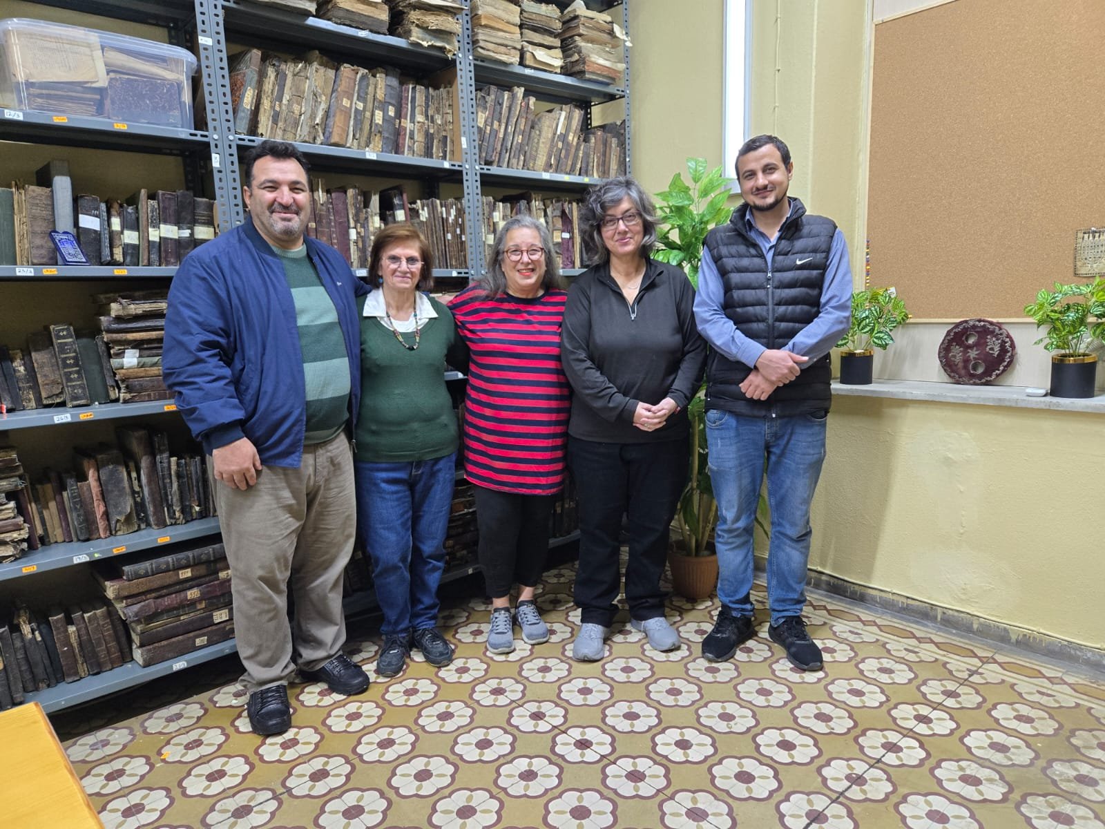 Volunteer team and community members inside the renewed Rabbinic Library in December 2024.